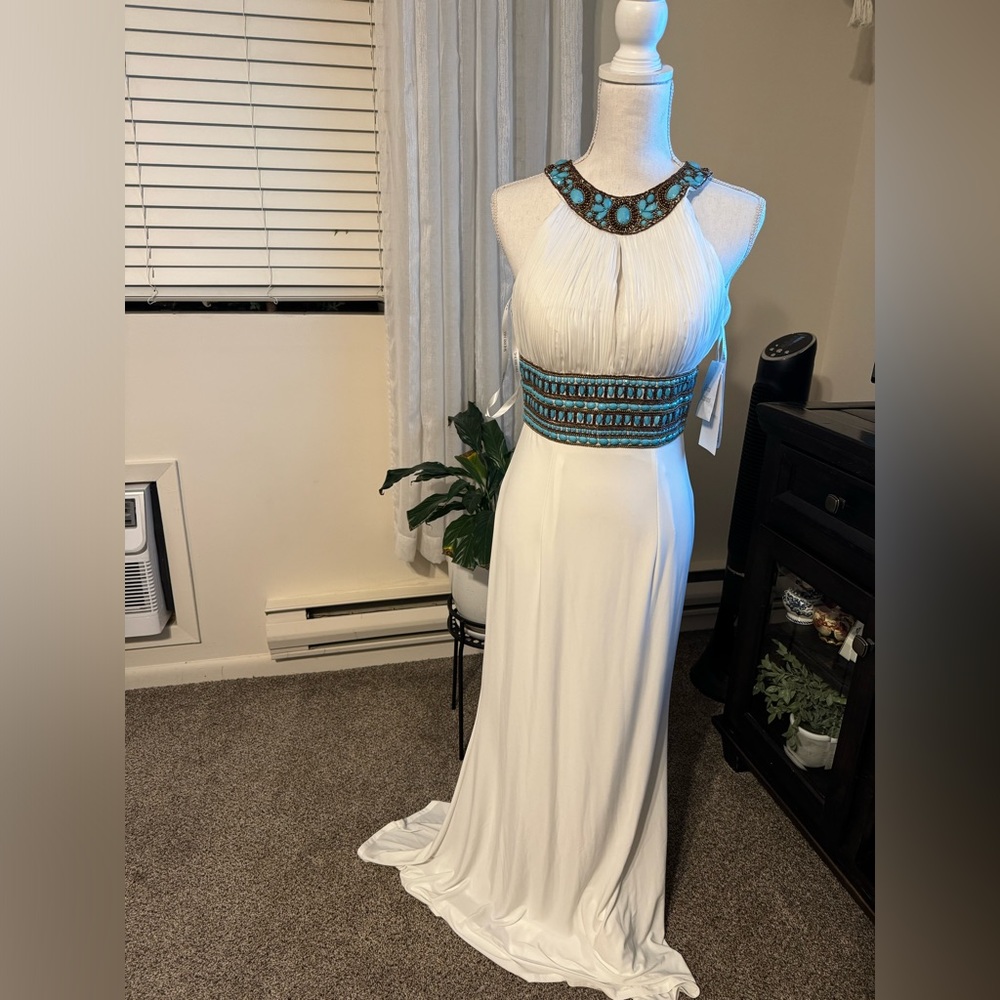 Beautiful Sherri Hill gown with turquoise beading.